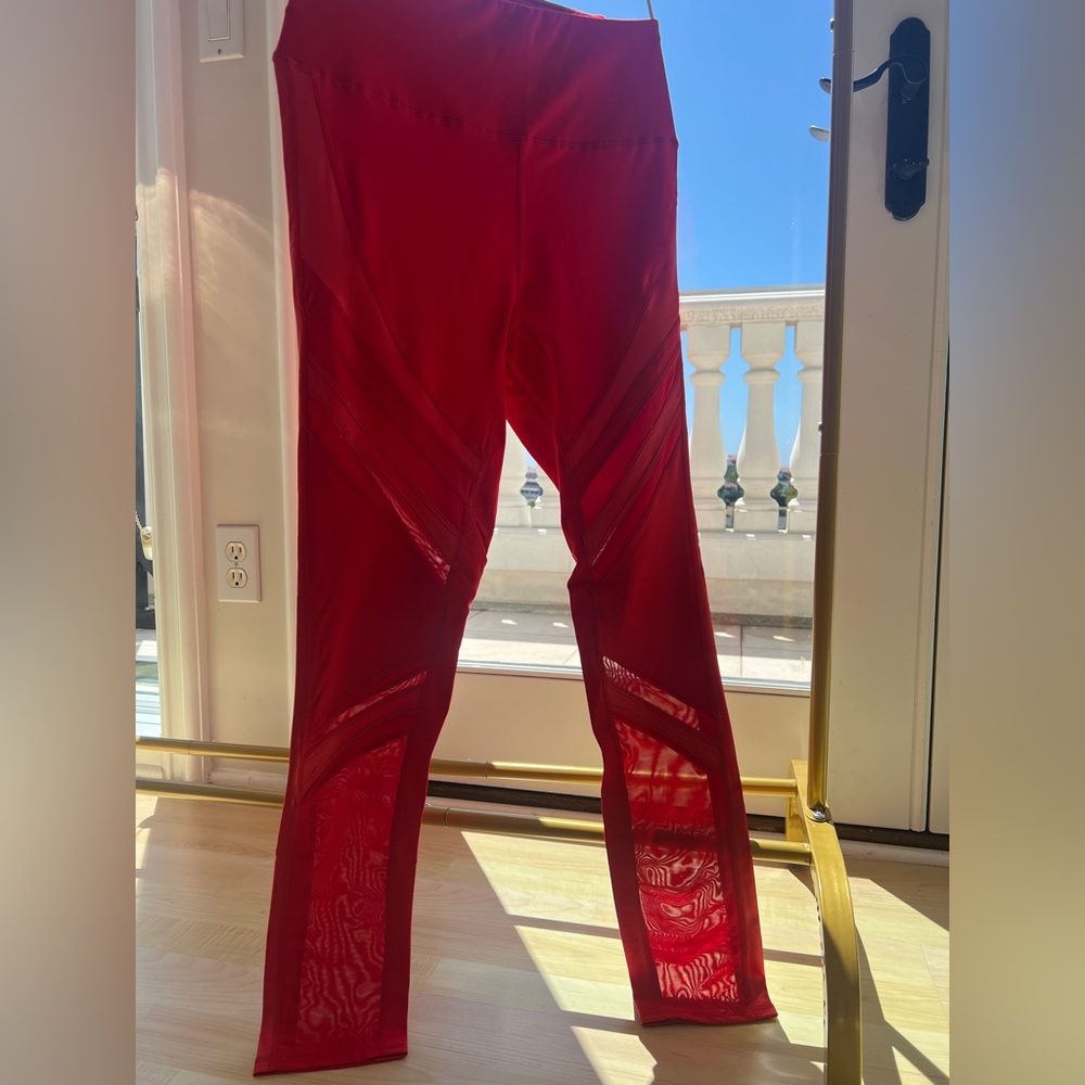 Red legging with mesh design. New with tags. Multiple sizes available